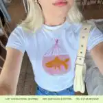 Goldfish Graphic Baby Tee – Retro Hand-Painted Pink Design