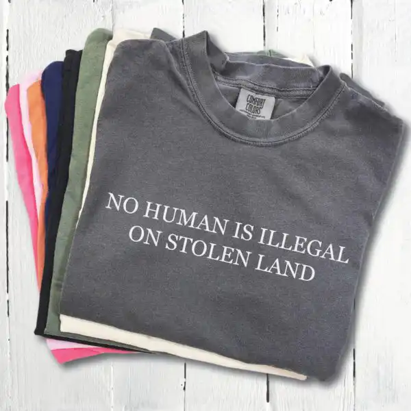 No Human Is Illegal on Stolen Land Tee – Retro Activist Shirt