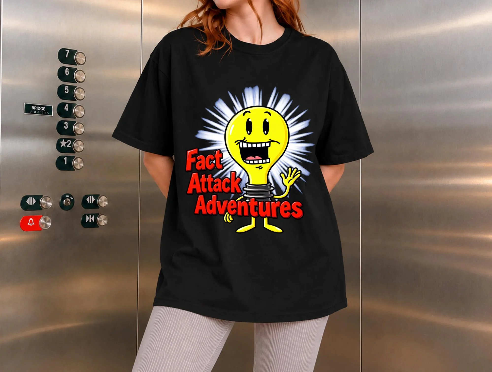 Fact Attack Adventures Funny Light Bulb Graphic Shirt